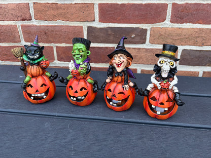5.7" H set of 4  Halloween Figures on Pumpkins lights up! IN STOCK