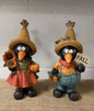 SET OF TWO PRIMITIVE CROWS